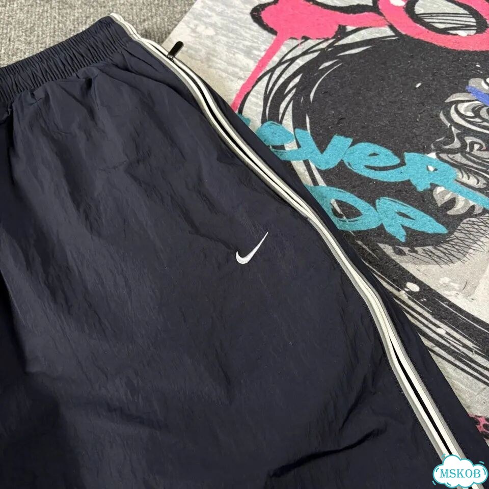 Штаны спортивные Nike flared синие мужские фото 4