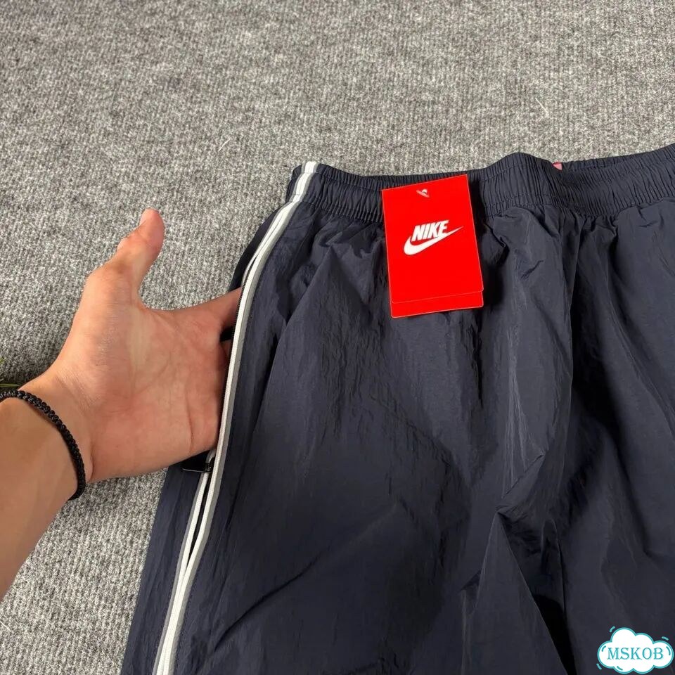 Штаны спортивные Nike flared синие мужские фото 5