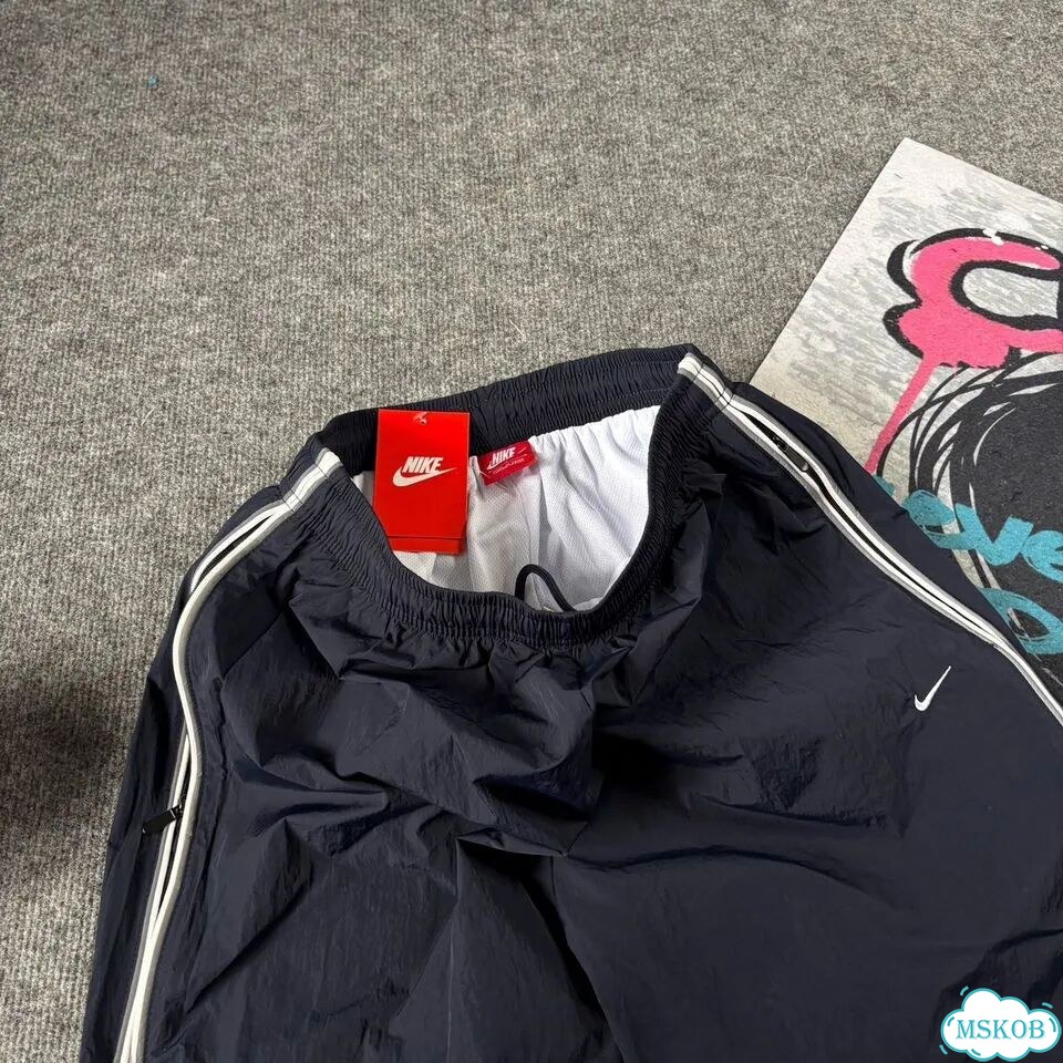 Штаны спортивные Nike flared синие мужские фото 6