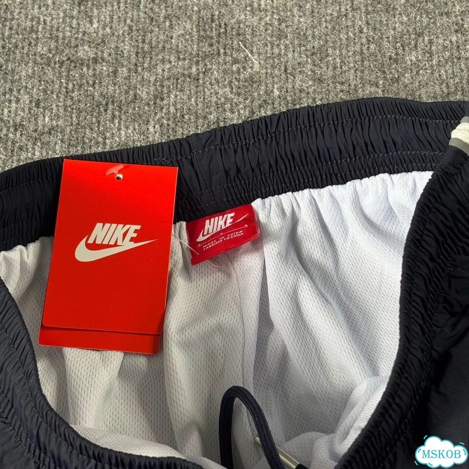 Штаны спортивные Nike flared синие мужские фото 7