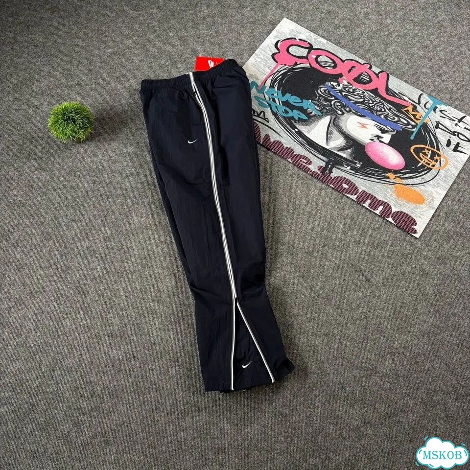Штаны спортивные Nike flared синие мужские фото 9